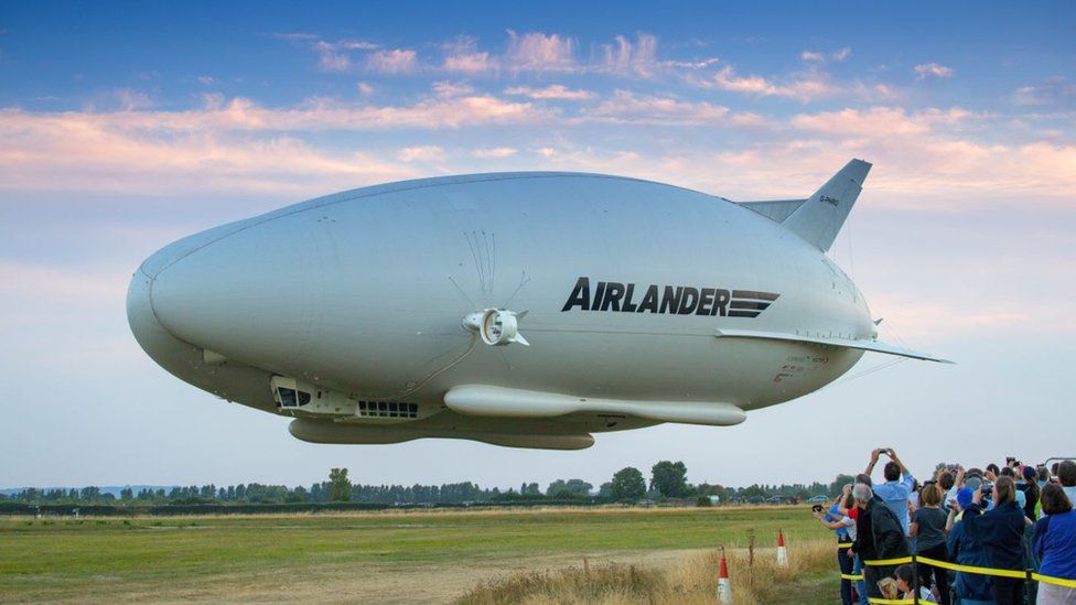 The HAV Airlander seen outside with a crowd of people looking at it