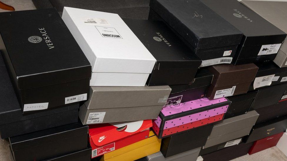 A collection of shoes in a number of boxes