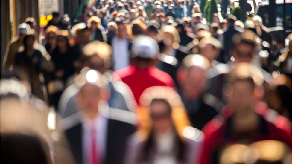 a stock image of a crowd of people