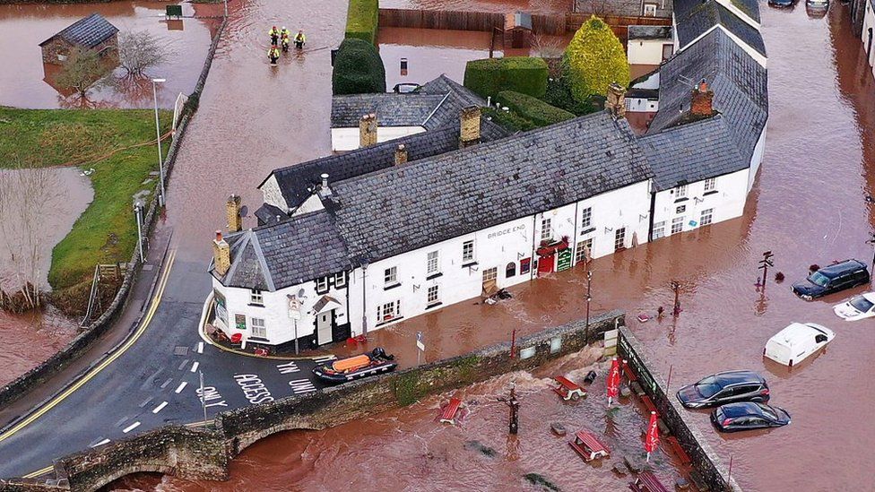 Building surrounded by muddy flood water