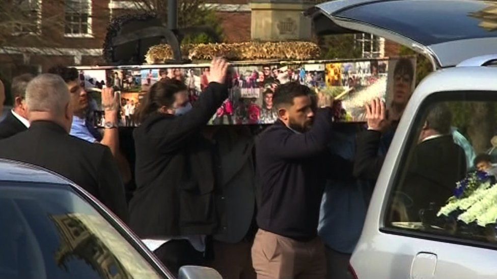 Family members carrying Ramarni's coffin