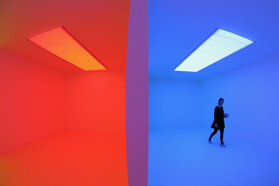 A woman admires an art installation by Carlos Cruz-Diez entitled 'Chromosaturation' which features in the Hayward Gallery's exhibition 'Light Show' on January 29, 2013 in London, England.