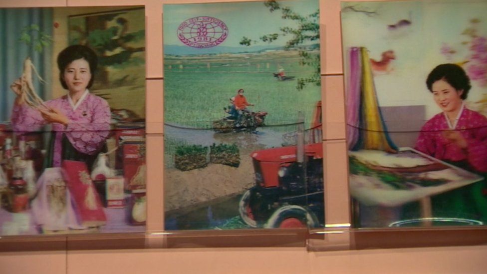 Holographic cards Nick Bonner has collected from various tourist spots in North Korea. From the left, a woman in traditional Korean costume holding ginseng, a worker ploughing field, and a woman practicing embroidery.