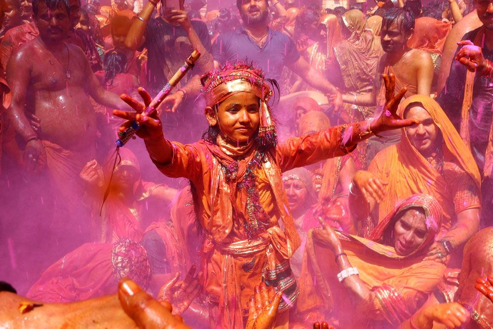 A Hindu devotee dances during the Huranga, a day after Holi, at Dauji temple near the northern city of Mathura, India March 26, 2024.