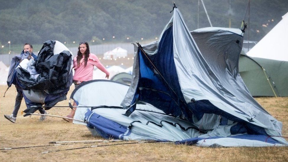Battered tent after heavy rain at Camp Bestival