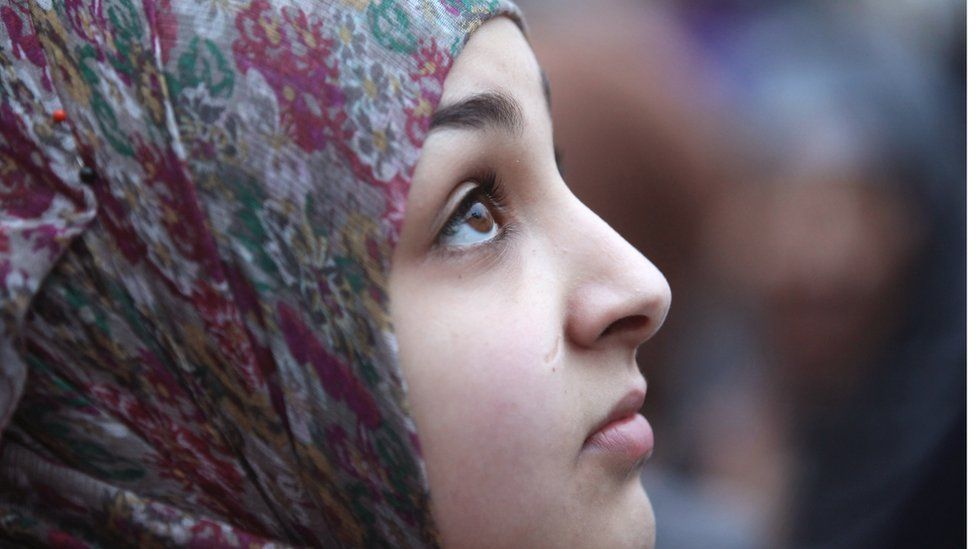 A young woman wearing a headscarf