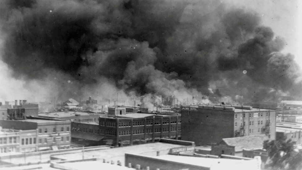 Smoke rises from buildings during the race riot in Tulsa, Oklahoma, U.S. in 1921