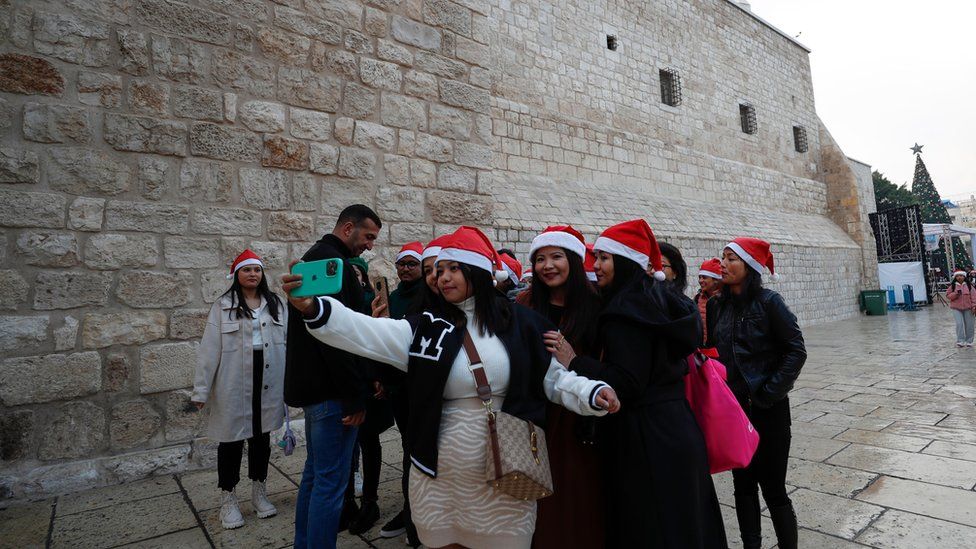 Women in Bethlehem taking a group selfie