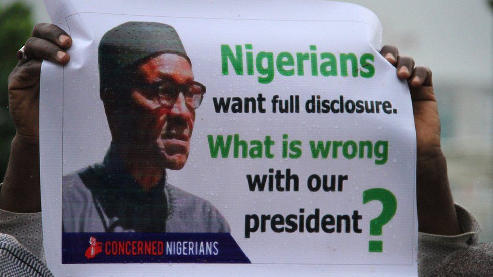 Poster reading: "Nigerians want full disclosure. What is wrong with our president?"