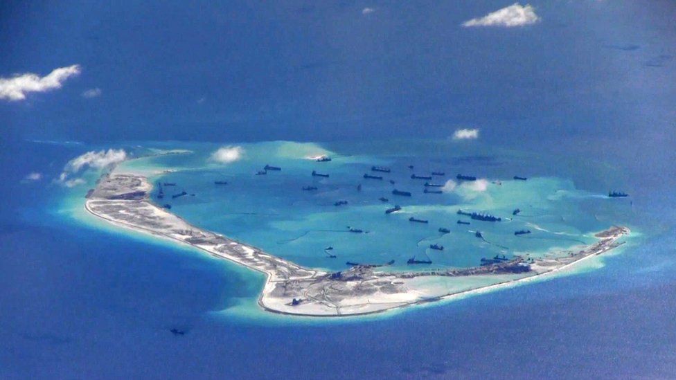 A still image from a US Navy video purportedly shows Chinese dredging vessels in the waters around Mischief Reef in the disputed Spratly Islands in in the South China Sea