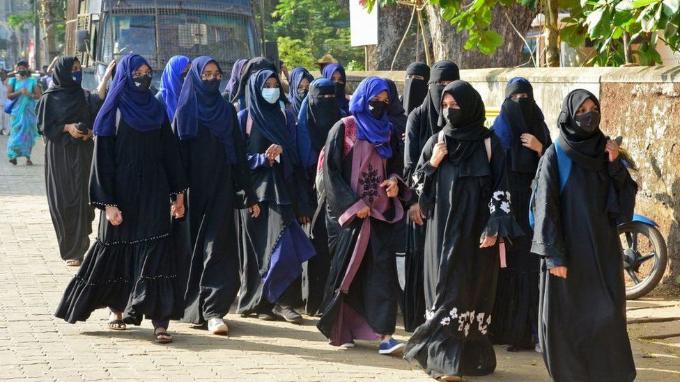 Students of government Pre-University college in Kundapur town wearing hijab arrive at their college in Udupi district in India's Karnataka state on February 7, 2022.