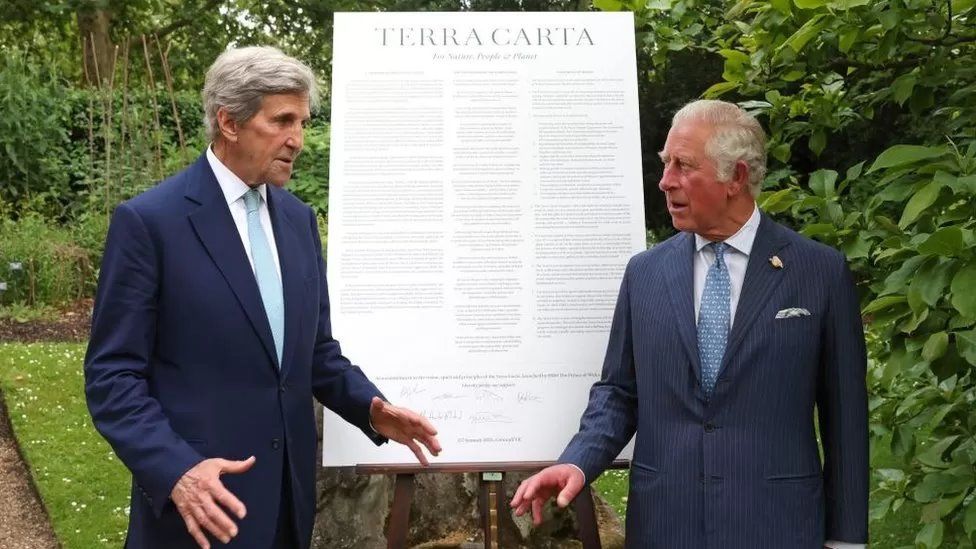 John Kerry stood next to King Charles