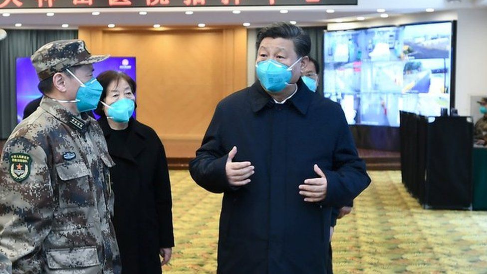 Xi Jinping speaks with workers at the Huoshenshan hospital