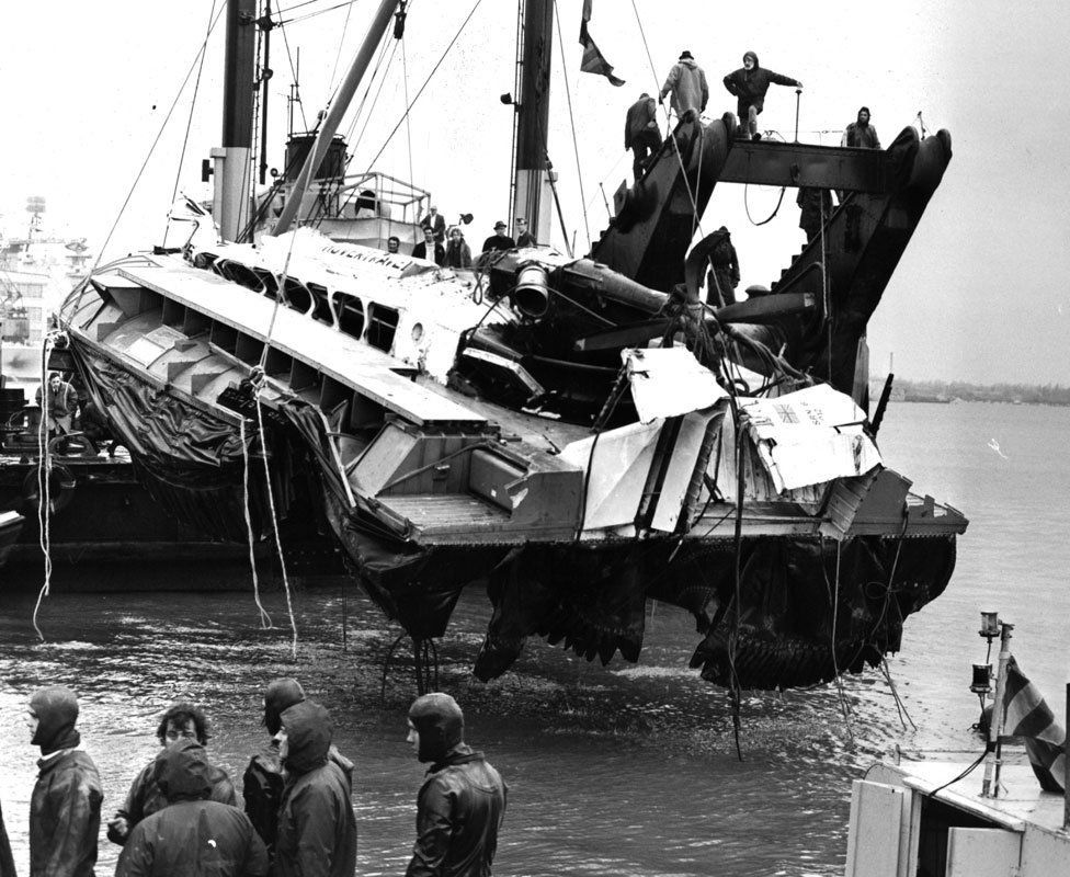 Watched by Royal Navy divers the battered SRN-6 hovercraft is raised from the Portsmouth seabed in England. March 8, 1972.
