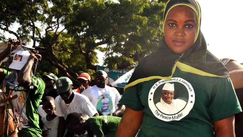 A supporter of outgoing Gambian President Yahya Jammeh wears a T-Shirt with a portrait of her candidate on November 22, 2011 during a campaign meeting in Bakau