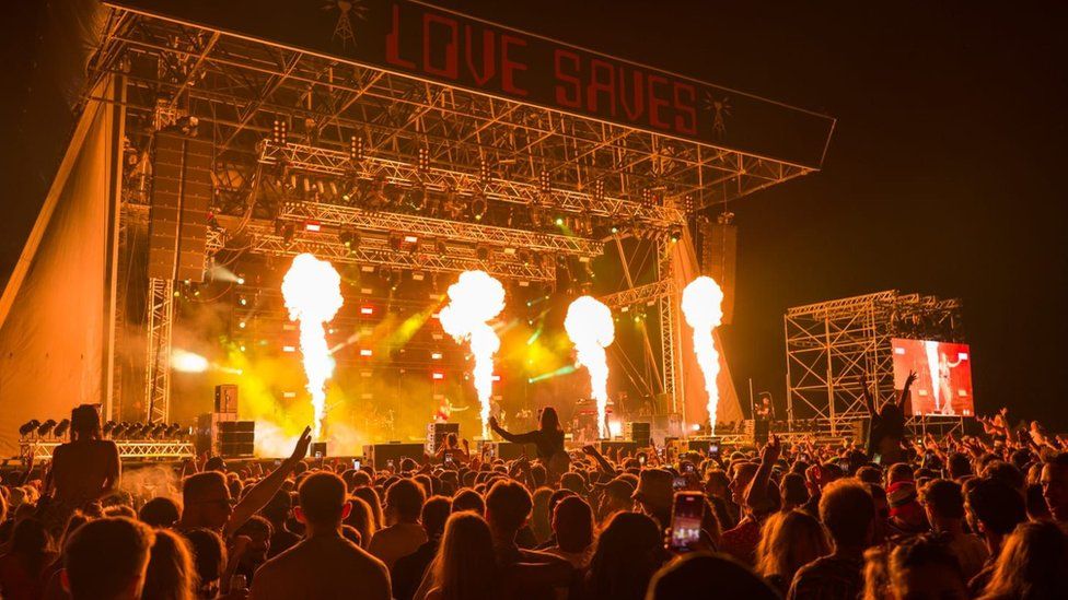 Love Saves stage at night