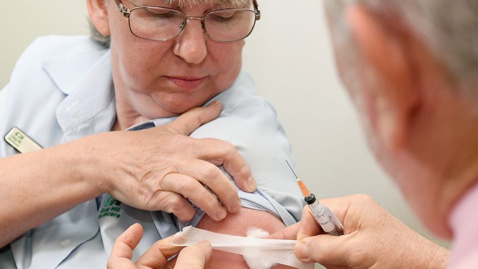 A nurse receives the vaccine jab in Brisbane in March 2021