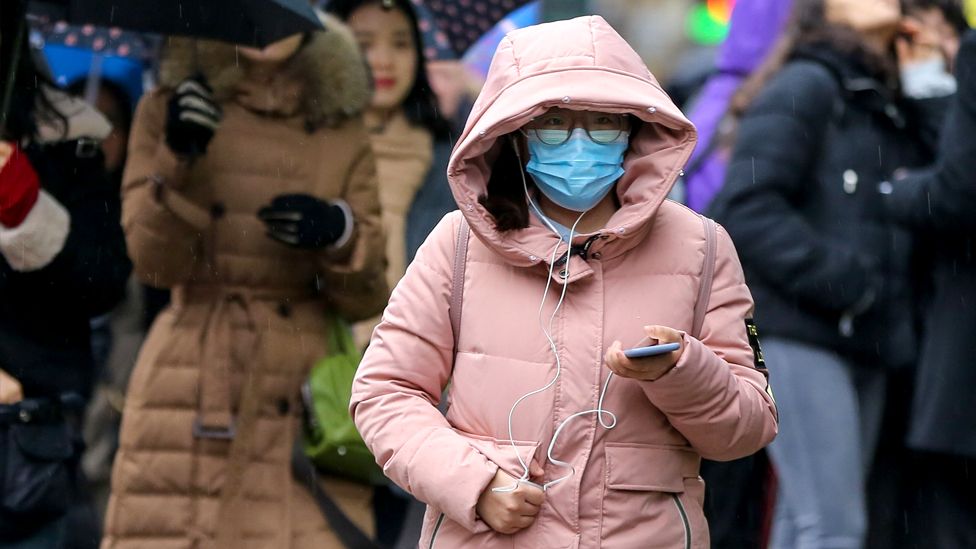 Woman in London wearing a face mask