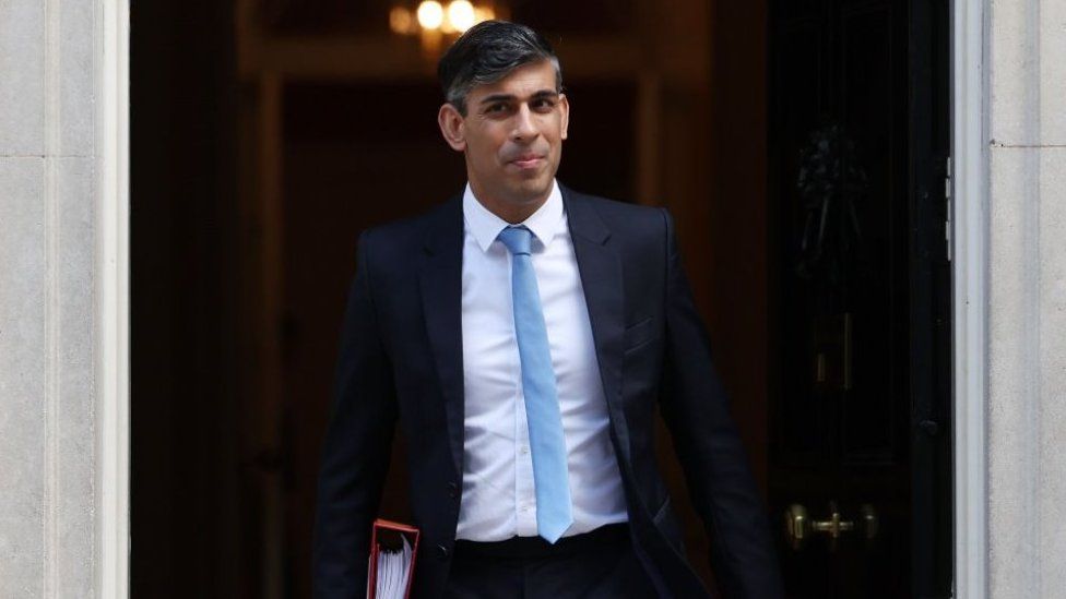 Rishi Sunak leaving Number 10 to attend PMQs on 17 April