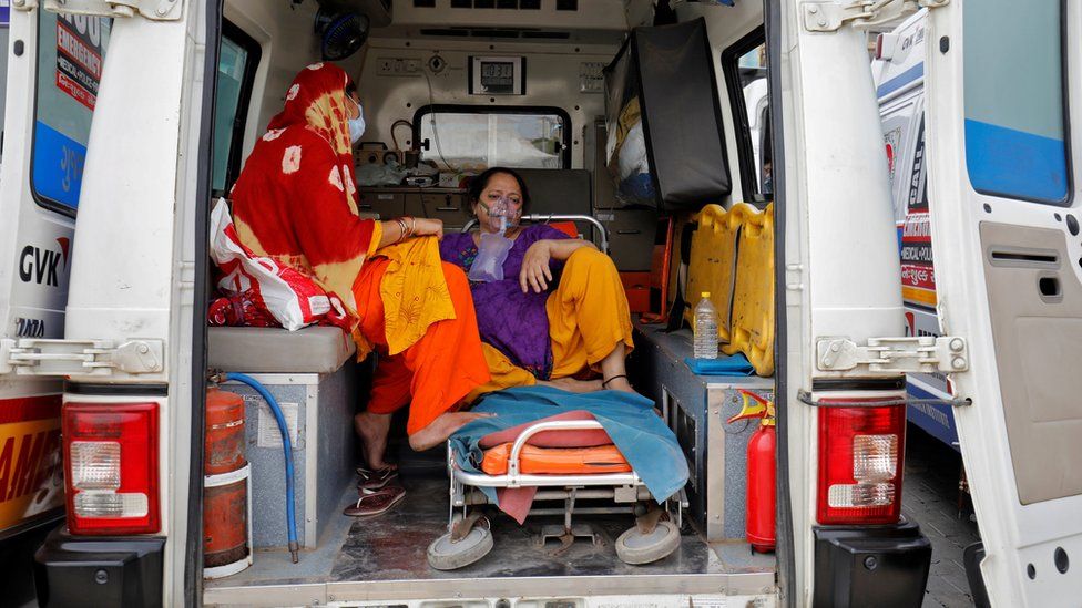 Patient with breathing apparatus in ambulance in Ahmedabad, India (20 April)