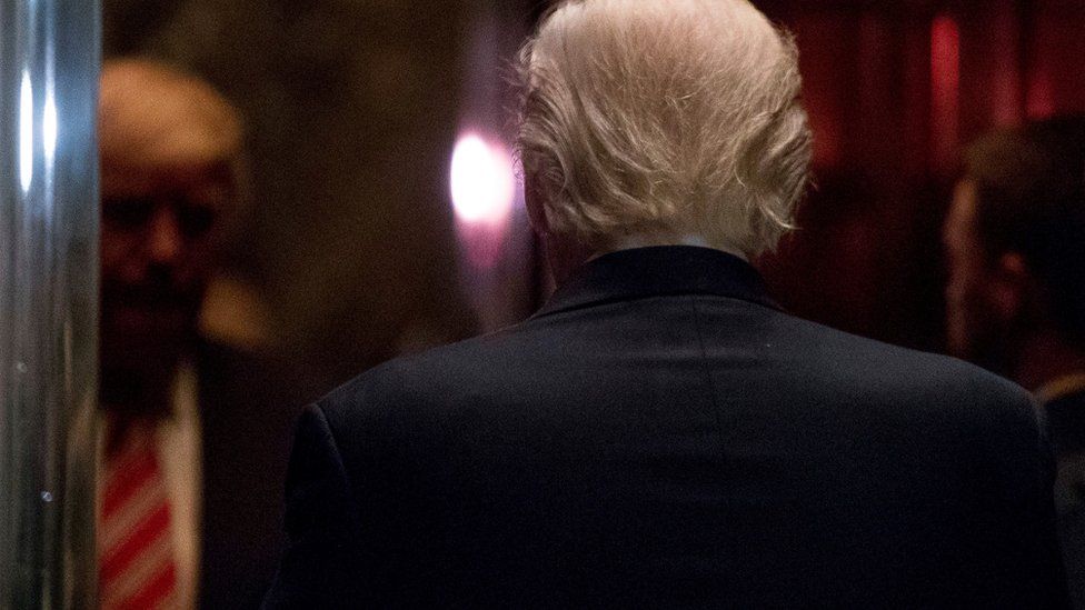 Donald Trump walks into an elevator at Trump Tower