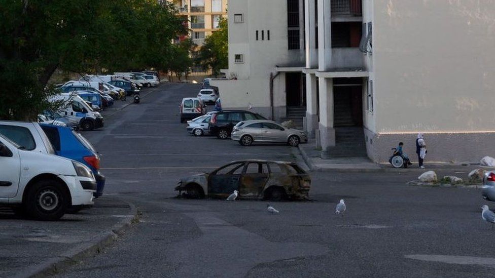 Burned-out car in "Les Rosiers" neighbourhood in Marseille