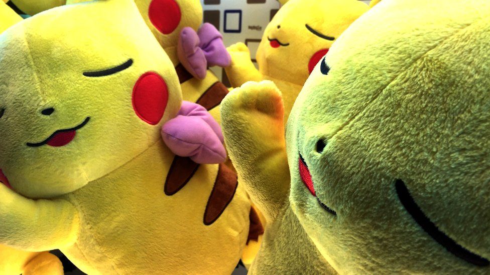 Two large pikachu stuffed toys