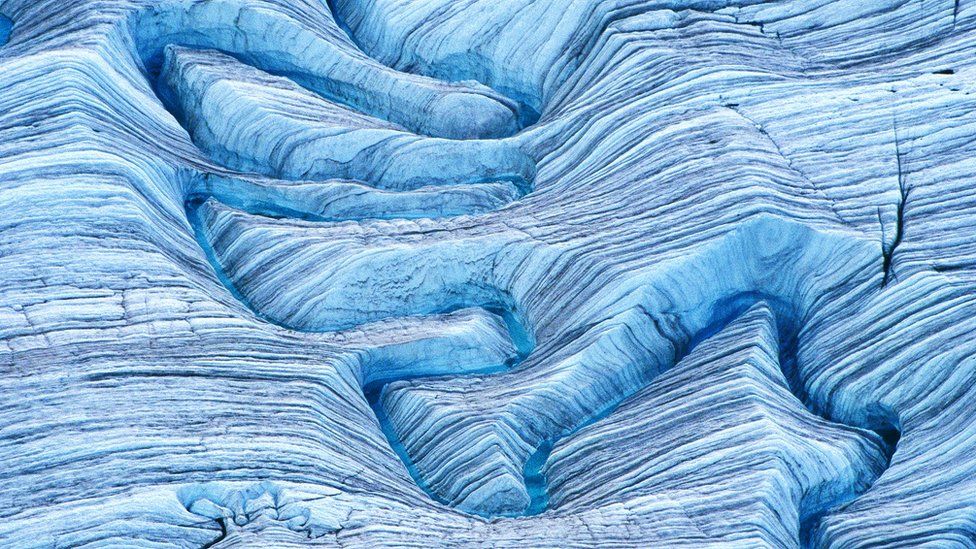 Melting water on glacier (aerial), Wrangell-St. Elias National Park, Alaska.