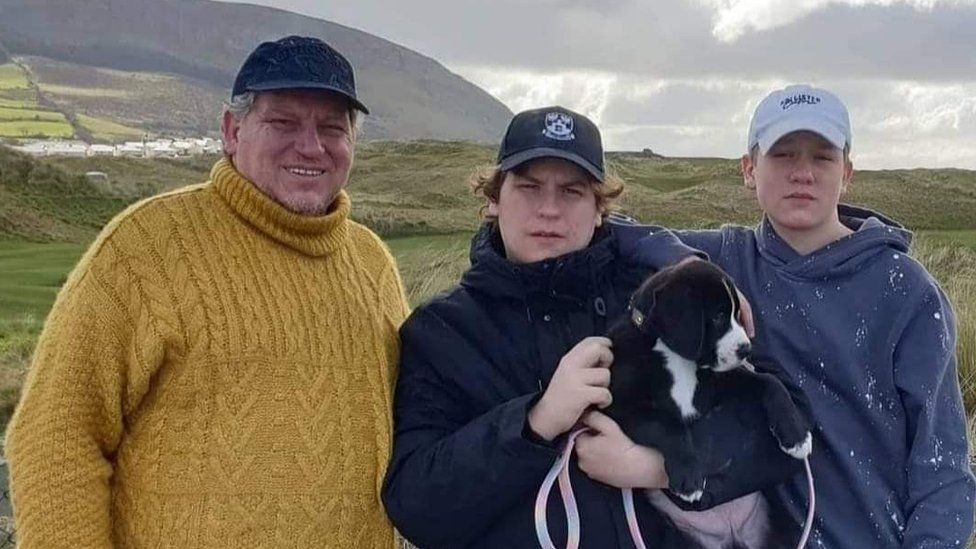 Robert Pether pictured with his two sons