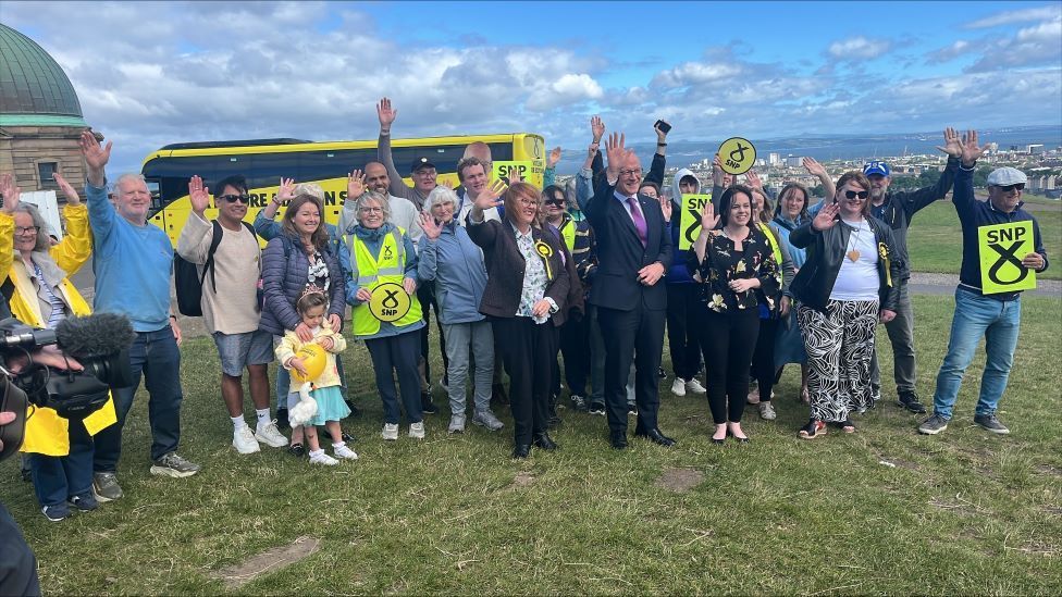 John Swinney and Kate Forbes are joined by SNP acvtivists to wave and cheer as the party started their last week of election campaigning