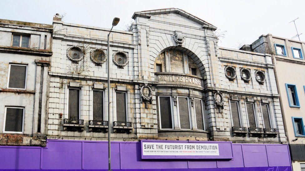 A general view shot of the Picture House/ Futurist Cinema in 2015 with signs outside saying 'save the futurist from demolition'