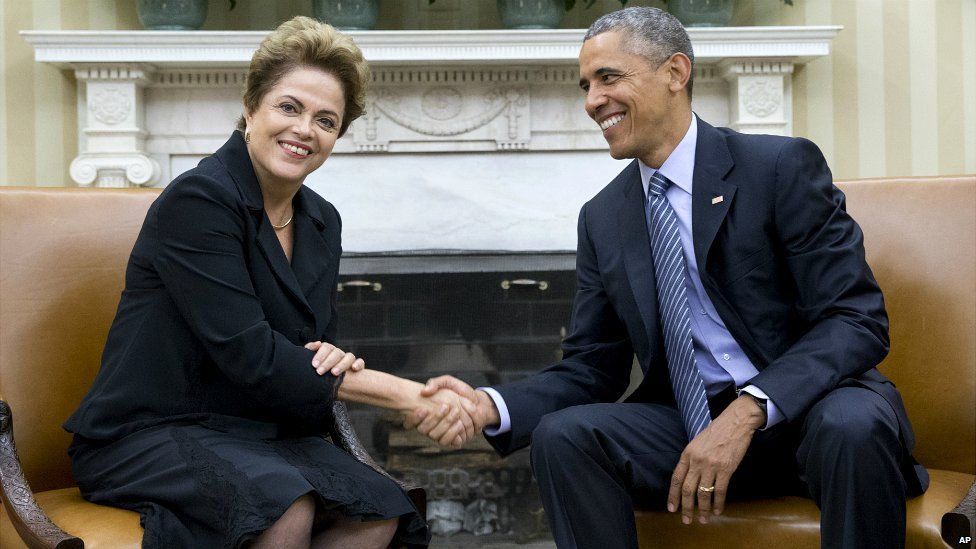 President Barack Obama shakes hands with Brazilian President Dilma Rousseff in the Oval Office of the White House - 30 June 2015