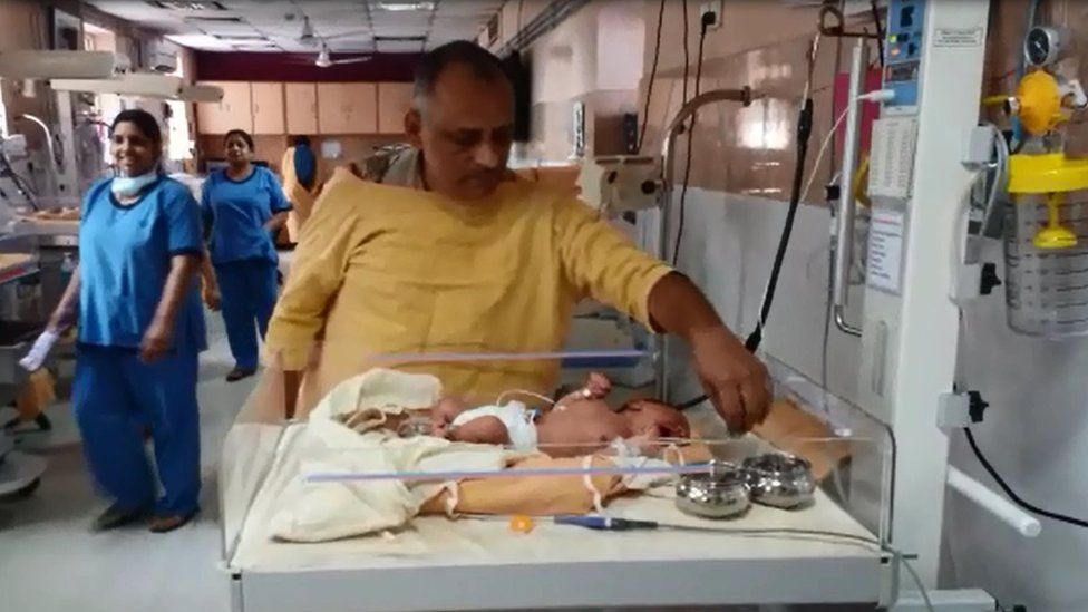 Police officer Somnath Paruthi with the baby
