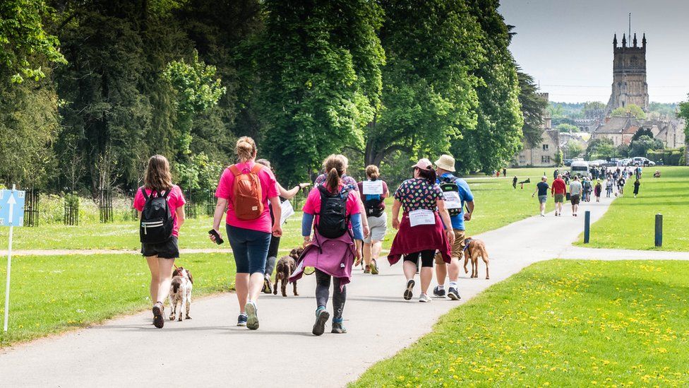 People waking in a park