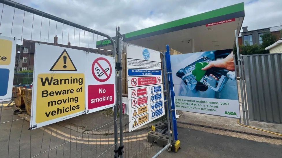 Asda petrol station closed with warning signs in front 
