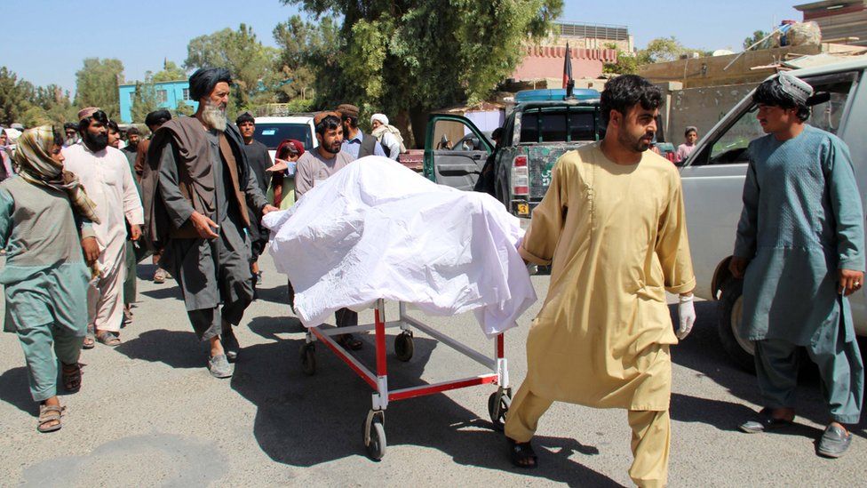 People move the bodies of their relatives who were killed in an air raid and ground assault on a Taliban hideout by Afghan special forces, in Helmand, Afghanistan, 23 September 2019.