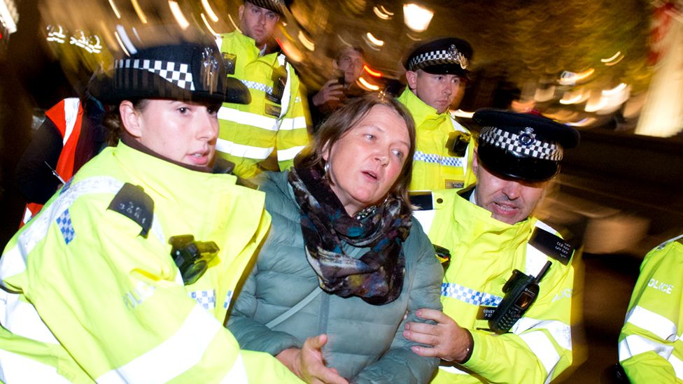 Green Party MEP Ellie Chowns being arrested at Trafalgar Square