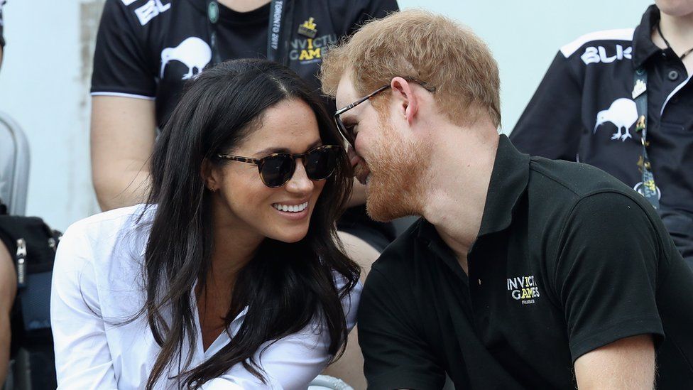 Prince Harry and Meghan Markle talking and smiling