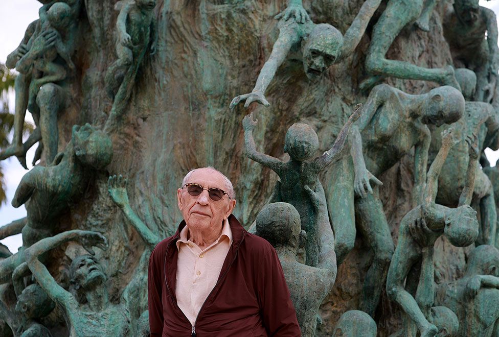 Holocaust survivor Jack Waksal stands in front of the Holocaust Memorial in Miami Beach, Florida