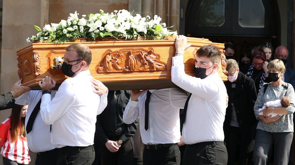 The coffin of Samantha Willis being carried at the service on Monday