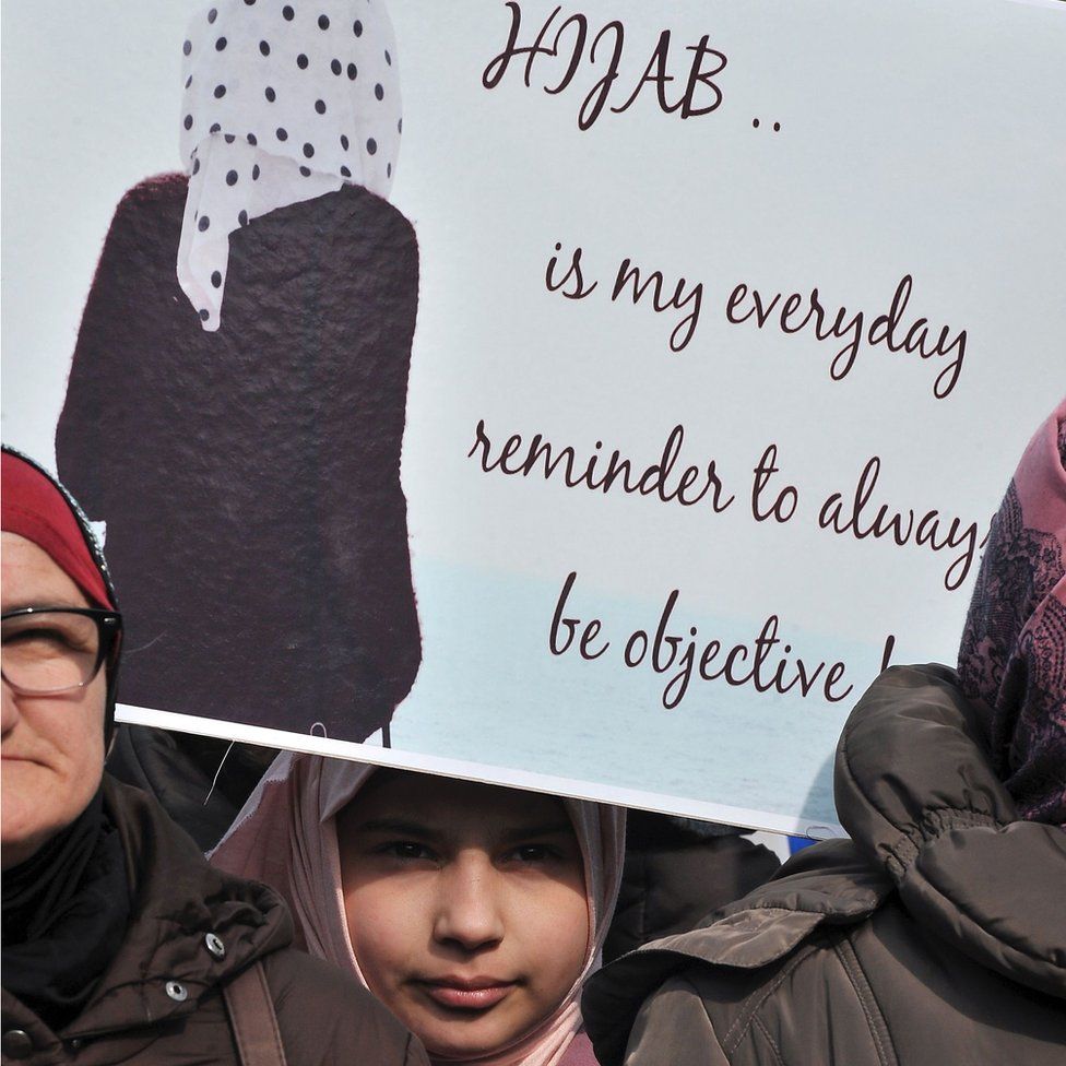 A participant holds up a placard as hundreds of Muslim women wearing the traditional Muslim headscarf also known as hijab protest in Sarajevo"s historical center, on February 7, 2016