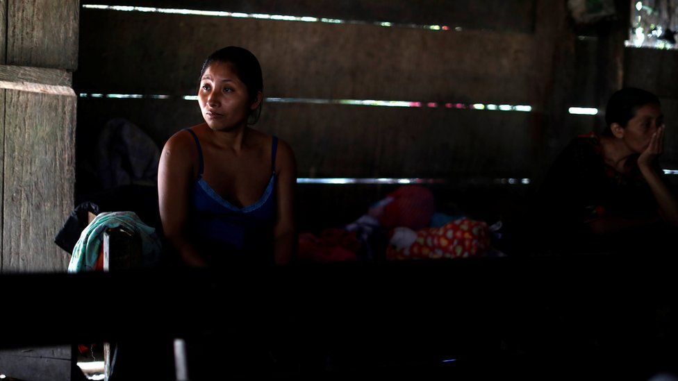 Claudia Maquin, mother of Jakelin Caal, waits for the arrival of her daughter"s coffin in San Antonio Secortez village, Guatemala, 22 December 2018