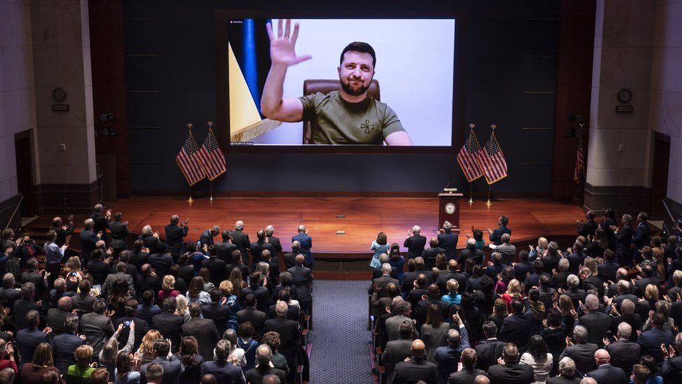 Ukraine"s President Volodymyr Zelensky (on screen) delivers a video address to senators and members of the US Congress