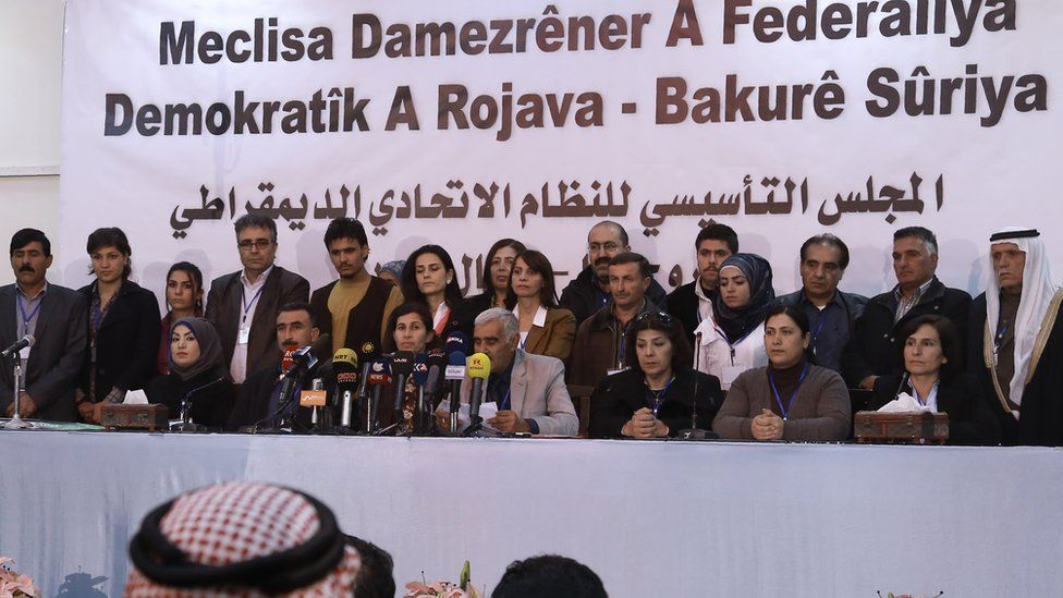 Delegates from Syrian Kurdish, Arab, Assyrian and other parties take part in a conference in Rumeilan at which a federal system in Kurdish-controlled northern regions was announced (17 March 2016)