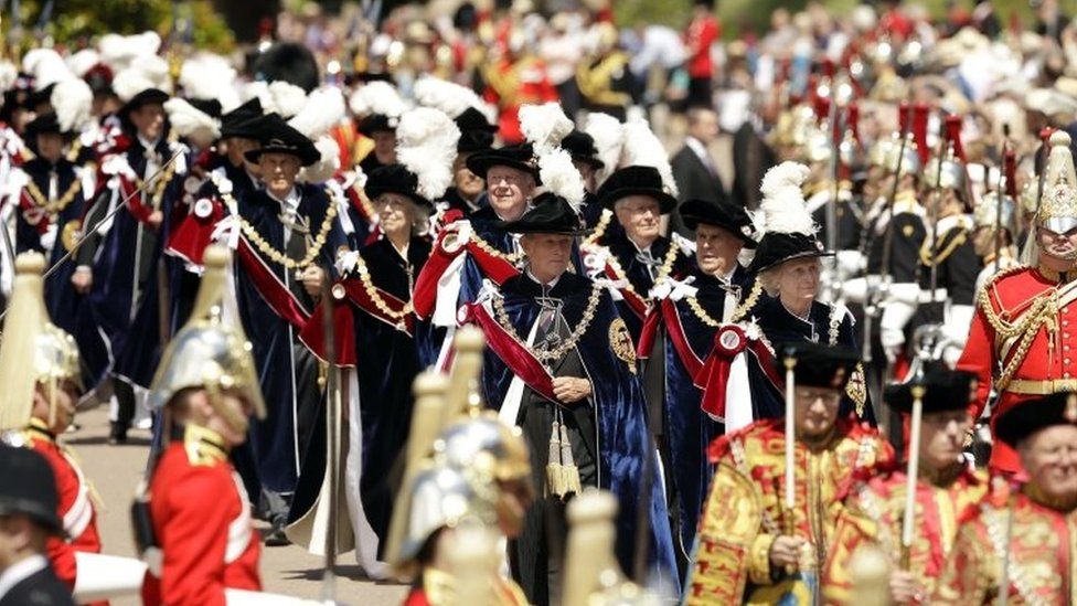 Knights of the garter parade through crowds in Windsor