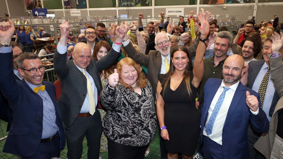 Alliance Party candidates celebrate their victories in the Stormont assembly election