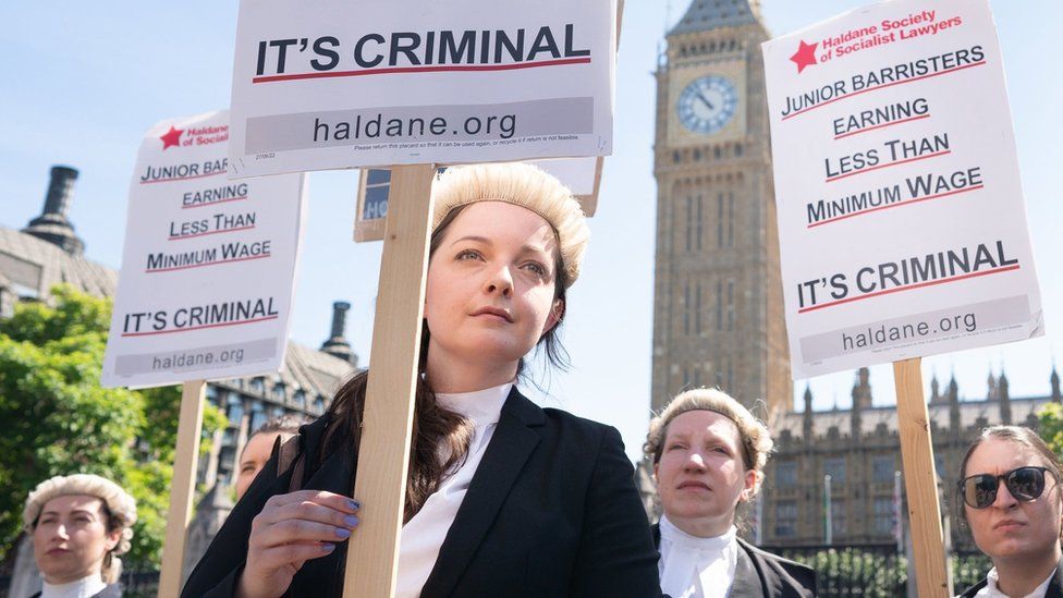Barristers holding banners at Westminster