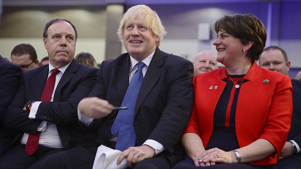 Boris Johnson, alongside Arlene Foster and Nigel Dodds, at the DUP party conference in 2018