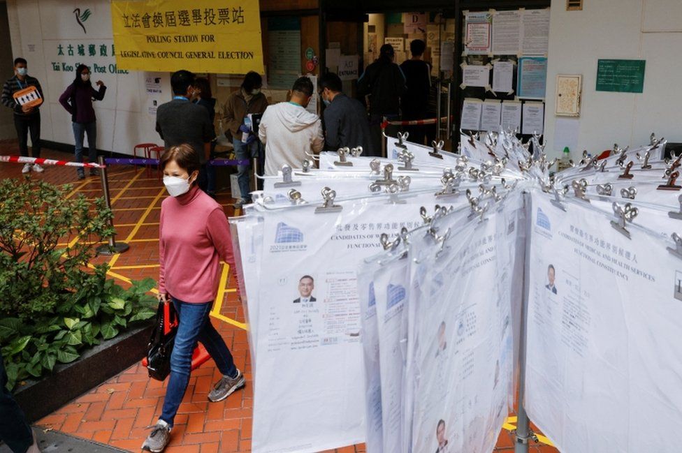 People queue to vote at a Hong Kong polling station