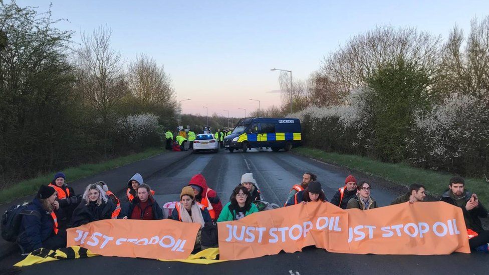 Handout photo issued by Just Stop Oil of their activists during one of their blockades at Kingsbury early on Friday